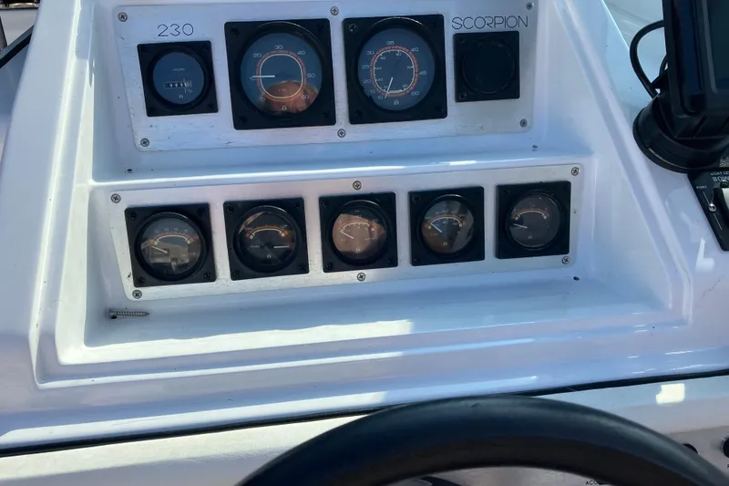 Slide: The Image of Dashboard of 1983 Chris-Craft 230 Scorpion boat with gauges and controls. - 9