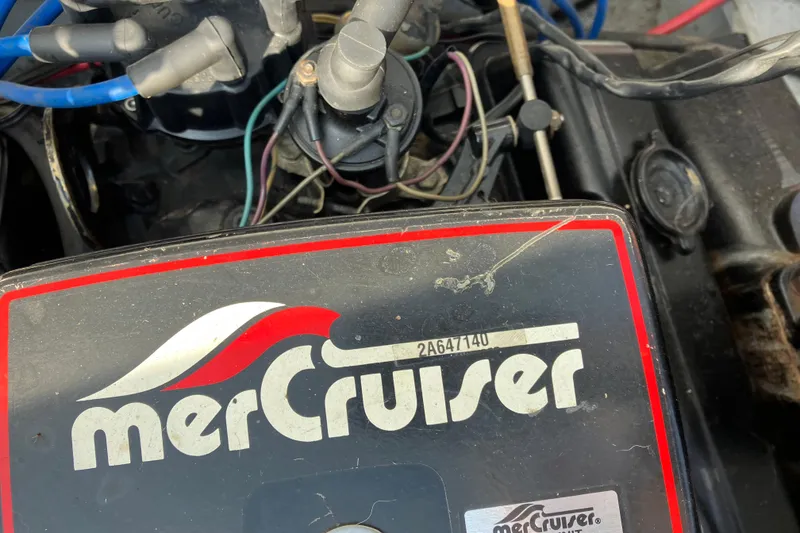Slide: The Image of 1983 Chris-Craft 230 Scorpion engine with MerCruiser branding and visible wiring. - 21