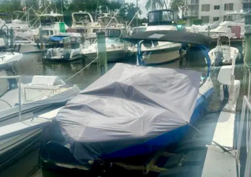 Slide: The Image of 2019 Yamaha Boats 242X E-Series covered at marina dock. - 18