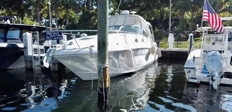 Slide: The Image of 2006 Sea Ray 340 Sundancer yacht docked, for sale, with American flag. - 14