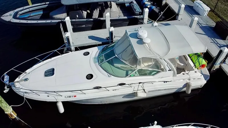 Slide: The Image of 2006 Sea Ray 340 Sundancer docked at marina, aerial view. - 2
