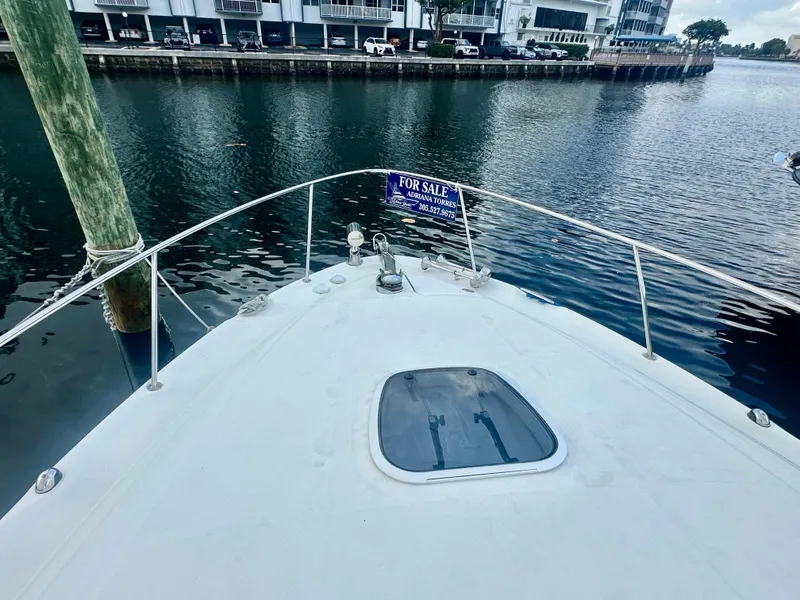 Slide: The Image of 2006 Sea Ray 340 Sundancer boat for sale, docked by waterfront. - 20