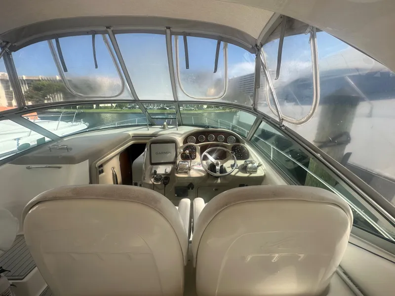 Slide: The Image of 2006 Sea Ray 340 Sundancer cockpit with dual seats and modern controls. - 30