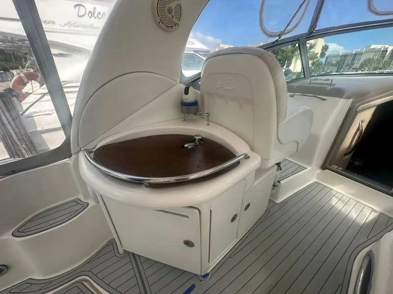 Slide: The Image of 2006 Sea Ray 340 Sundancer cockpit with seating and sink. - 39