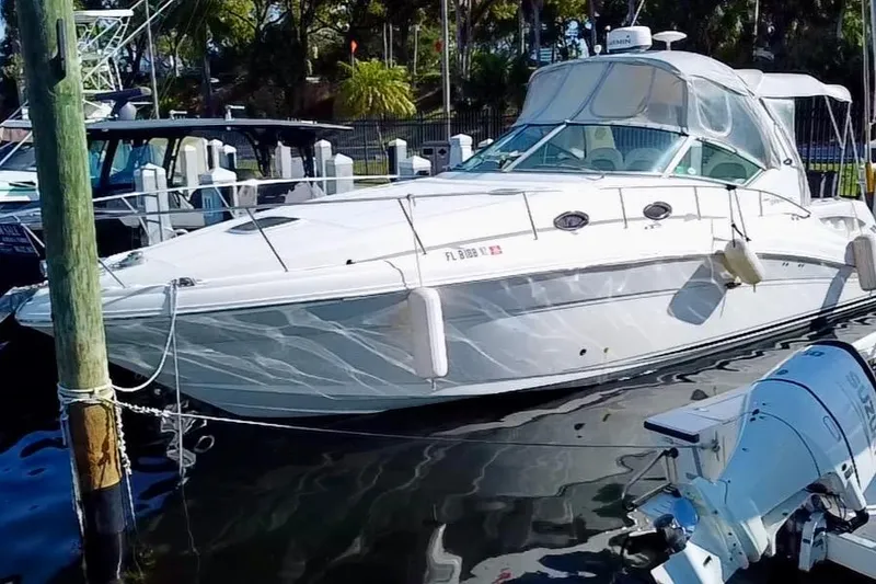 Slide: The Image of 2006 Sea Ray 340 Sundancer yacht docked at marina. - 6
