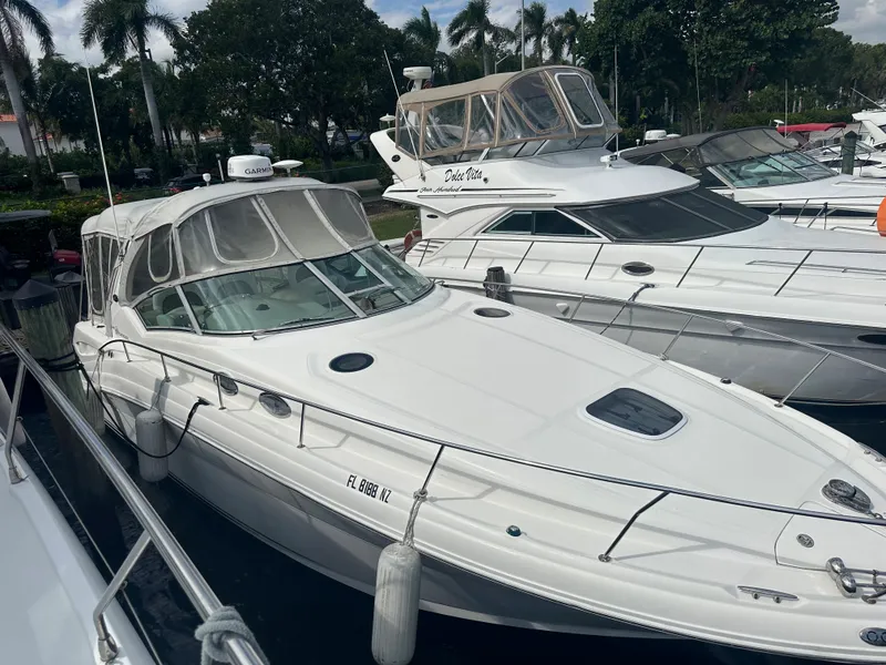 Slide: The Image of 2006 Sea Ray 340 Sundancer yacht docked at marina with other boats. - 9