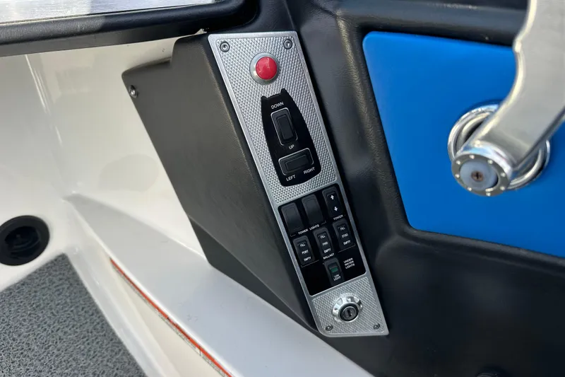 Slide: The Image of Control panel of 2016 MasterCraft X23 boat with switches and buttons. - 17