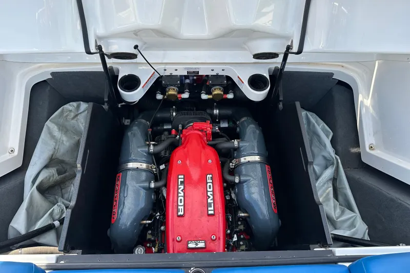 Slide: The Image of 2016 MasterCraft X23 engine compartment with Ilmor engine, showcasing powerful marine performance. - 25