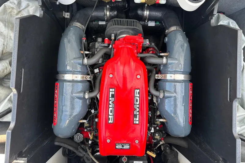Slide: The Image of 2016 MasterCraft X23 Ilmor engine with red and gray components. - 36