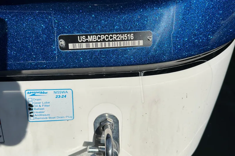 Slide: The Image of 2016 MasterCraft X23 boat with identification plate and maintenance checklist. - 39