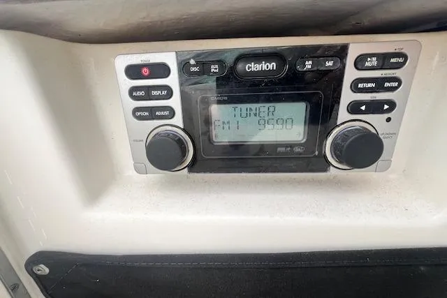 Slide: The Image of Clarion stereo system in 2011 Chaparral 224 Sunesta boat, displaying FM tuner. - 14
