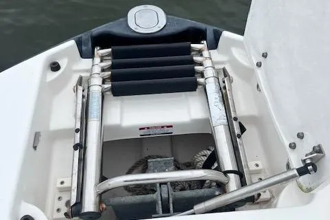 Slide: The Image of 2011 Chaparral 224 Sunesta boat ladder and anchor storage compartment. - 18