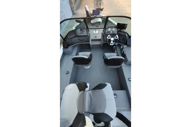 Slide: The Image of 2022 G3 Angler V164 F boat interior with seating and steering console. - 11