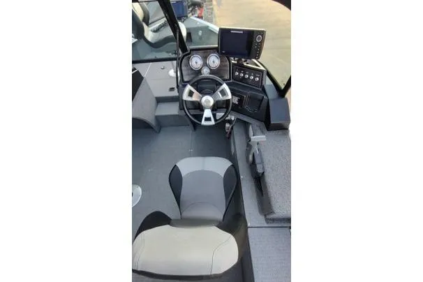 Slide: The Image of 2022 G3 Angler V164 F boat interior with steering wheel and dashboard controls. - 9