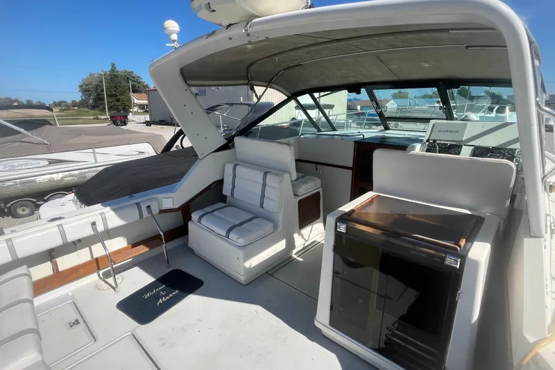Slide: The Image of 1987 Tiara Yachts 3100 Open interior with seating and navigation equipment. - 6