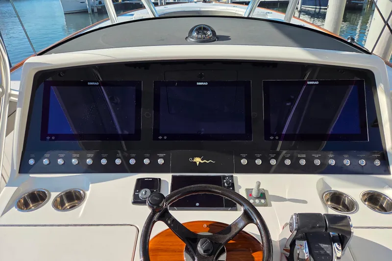 Slide: The Image of 2021 Valhalla Boatworks V-41 interior with luxurious seating and modern dashboard. - 10