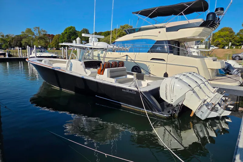 Slide: The Image of Luxurious seating on 2021 Valhalla Boatworks V-41, featuring diamond-stitched gray upholstery. - 20