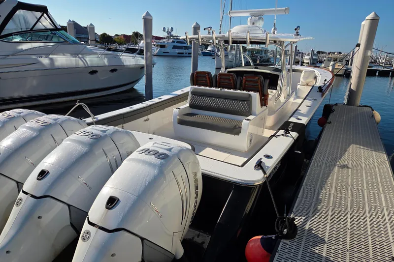 Slide: The Image of 2021 Valhalla Boatworks V-41 docked, featuring sleek design and powerful Mercury engines. - 3