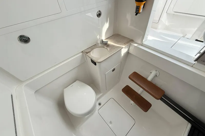 Slide: The Image of 2021 Valhalla Boatworks V-41 interior with compact bathroom and wooden steps. - 28