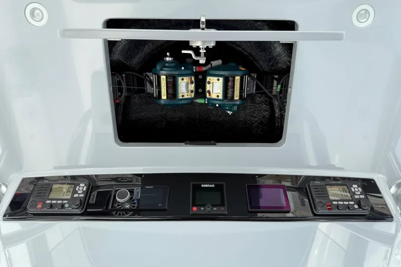 Slide: The Image of 2021 Valhalla Boatworks V-41 control panel with advanced navigation and communication systems. - 27