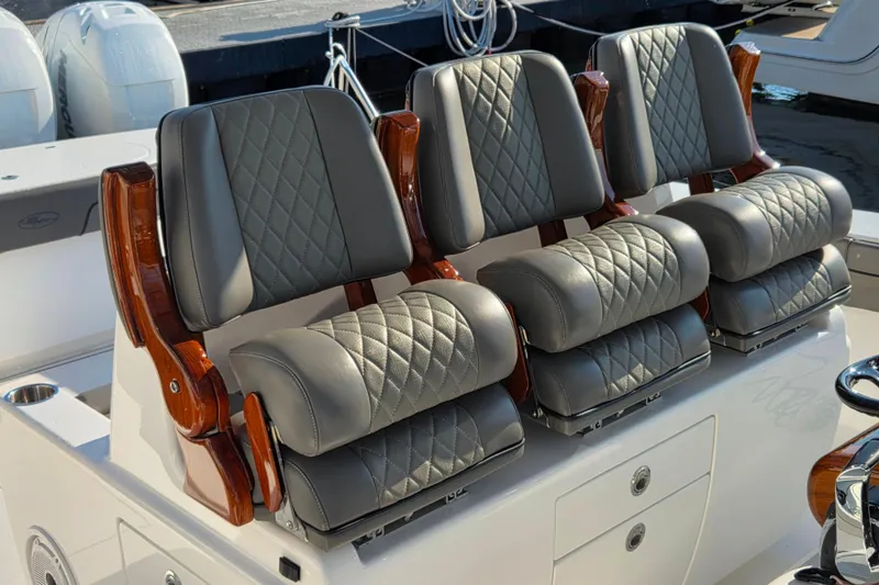 Slide: The Image of Luxurious seating on 2021 Valhalla Boatworks V-41, featuring diamond-stitched leather and wooden accents. - 23