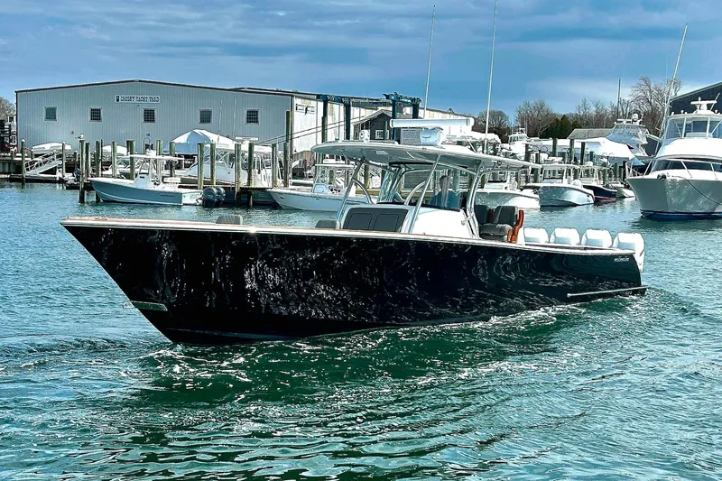 The Image of 2021 Valhalla Boatworks V-41 cruising in a marina, surrounded by other boats. - 0