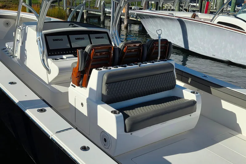 Slide: The Image of 2021 Valhalla Boatworks V-41 interior with seating and Simrad navigation displays. - 11