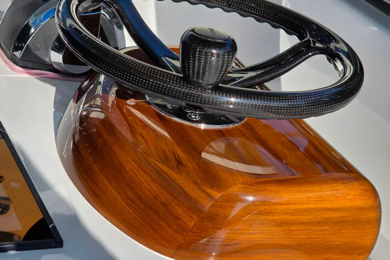 Slide: The Image of Steering wheel of 2021 Valhalla Boatworks V-41 with wood finish detail. - 18