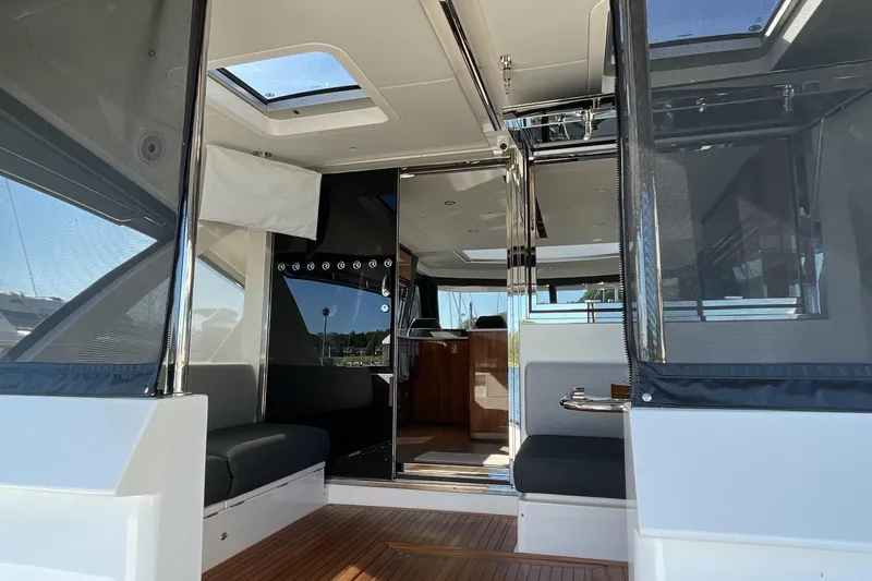 Slide: The Image of Interior view of 2025 Riviera 585 SUV yacht, featuring sleek design and modern amenities. - 12