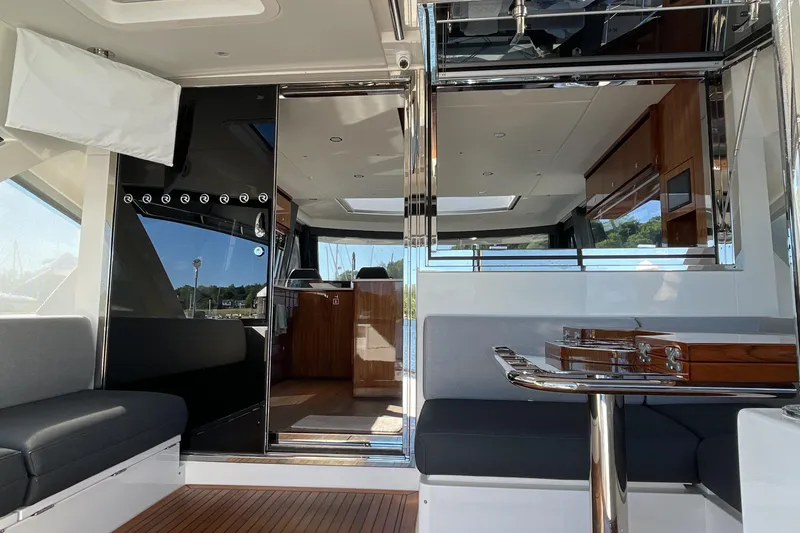 Slide: The Image of Luxurious interior of 2025 Riviera 585 SUV yacht with sleek design and modern furnishings. - 14