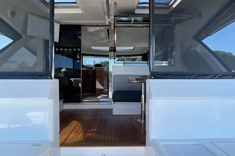 Slide: The Image of 2025 Riviera 585 SUV yacht interior with sleek design and wooden flooring. - 2