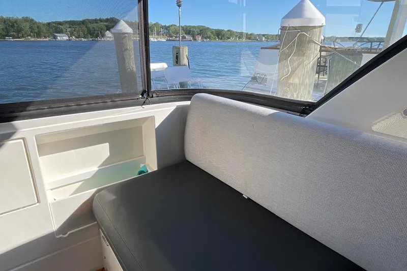 Slide: The Image of Interior view of 2025 Riviera 585 SUV yacht with waterfront backdrop. - 21