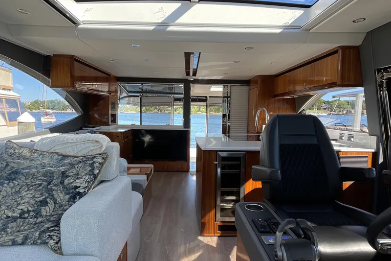 Slide: The Image of Luxurious interior of 2025 Riviera 585 SUV yacht with modern furnishings and scenic water view. - 28