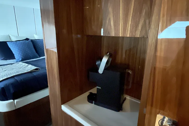 Slide: The Image of Luxurious interior of 2025 Riviera 585 SUV with coffee maker and cozy bedroom. - 55