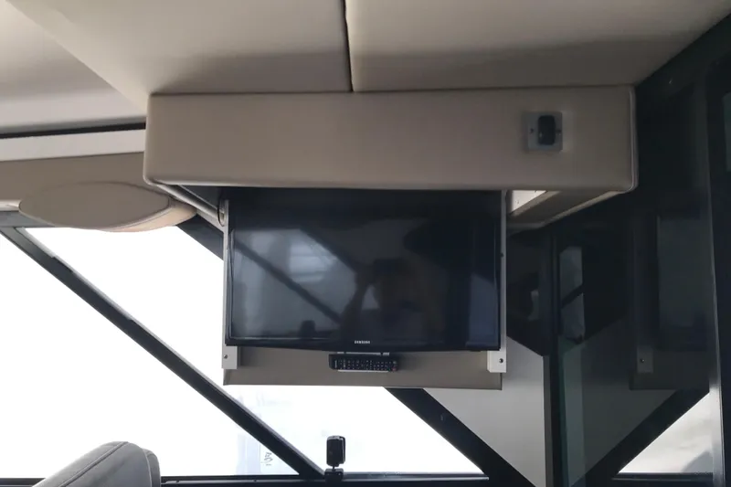 Slide: The Image of Interior of 2013 Regal 42 Sport Coupe featuring a mounted flat-screen TV. - 19