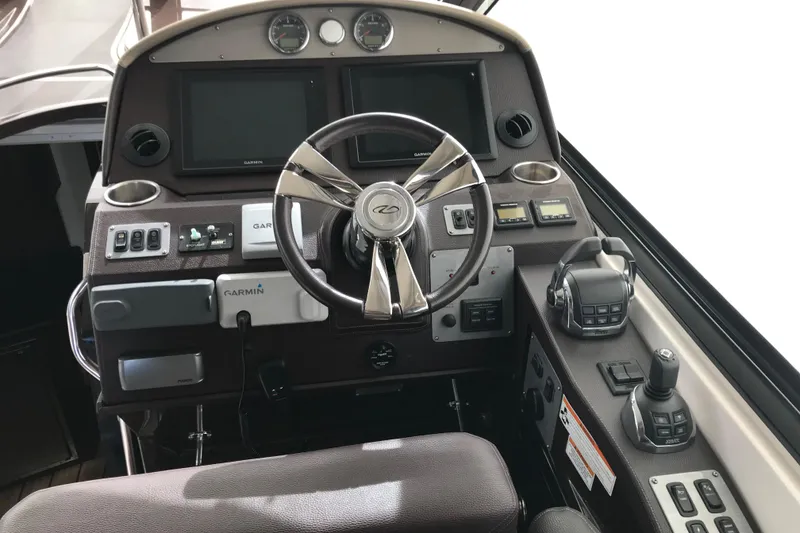 Slide: The Image of Cockpit of 2013 Regal 42 Sport Coupe with Garmin navigation and modern controls. - 21