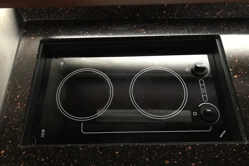 Slide: The Image of Built-in electric cooktop on 2013 Regal 42 Sport Coupe yacht kitchen. - 29