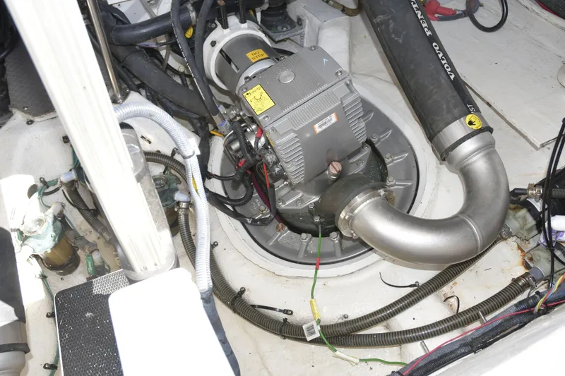 Slide: The Image of Engine compartment of a 2013 Regal 42 Sport Coupe, featuring mechanical components and wiring. - 42