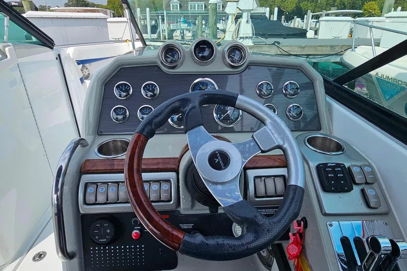 Slide: The Image of Steering console of a 2011 Formula 290 Bowrider boat with gauges and controls. - 15
