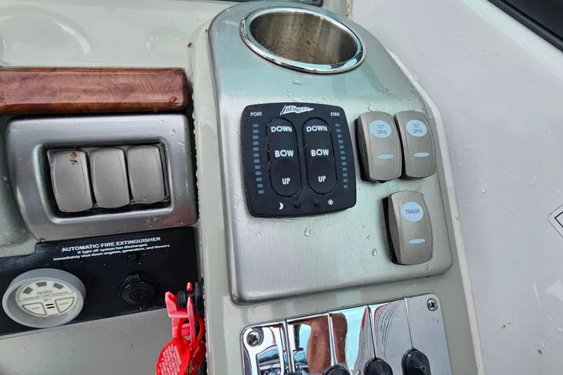 Slide: The Image of Control panel of a 2011 Formula 290 Bowrider boat with various switches and buttons. - 19