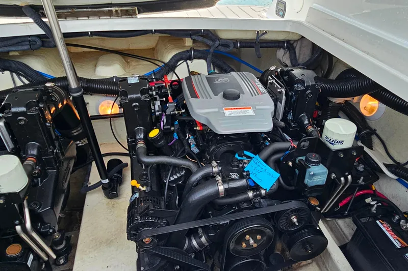 Slide: The Image of Engine compartment of a 2011 Formula 290 Bowrider boat, showcasing detailed mechanical components. - 29