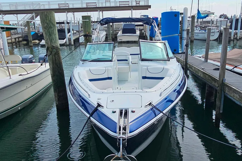 Slide: The Image of 2011 Formula 290 Bowrider docked at marina, featuring sleek design and spacious seating. - 31