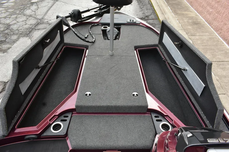 Slide: The Image of 2022 Nitro Z18 boat interior with open storage compartments and carpeted deck. - 10
