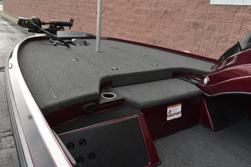 Slide: The Image of 2022 Nitro Z18 boat deck with carpeted surface and fishing rod holder. - 3