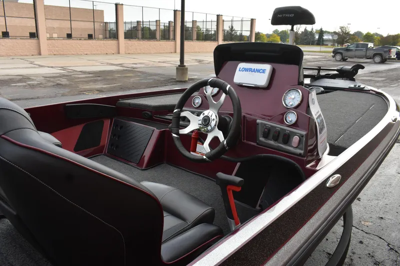 Slide: The Image of 2022 Nitro Z18 boat interior with steering wheel and Lowrance display. - 7