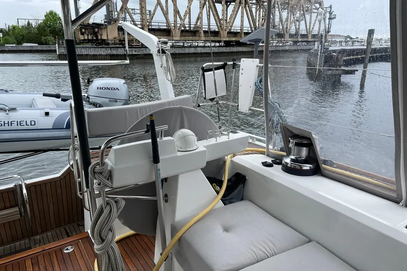 Slide: The Image of Cockpit view of 2017 Beneteau Sense 57 yacht with marina backdrop. - 105