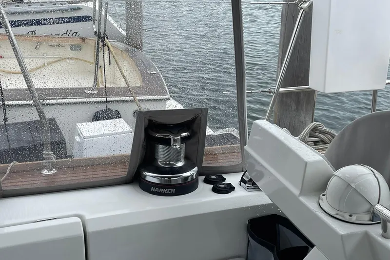 Slide: The Image of Cockpit view of 2017 Beneteau Sense 57 yacht with Harken winch and marina backdrop. - 110