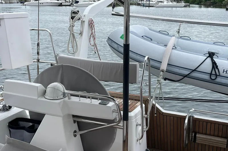 Slide: The Image of Cockpit of 2017 Beneteau Sense 57 yacht with inflatable dinghy on deck. - 117