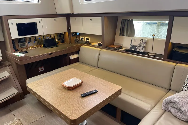 Slide: The Image of Luxurious interior of 2017 Beneteau Sense 57 yacht with modern seating and navigation area. - 121
