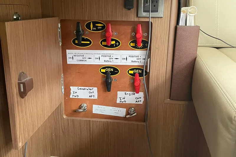 Slide: The Image of Electrical panel on a 2017 Beneteau Sense 50 yacht, featuring labeled switches and outlets. - 15